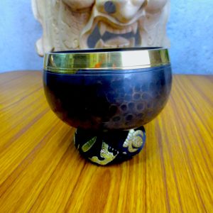 Patched Black Singing Bowl Cushion