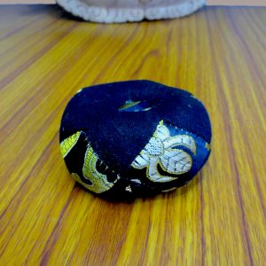 Patched Black Singing Bowl Cushion