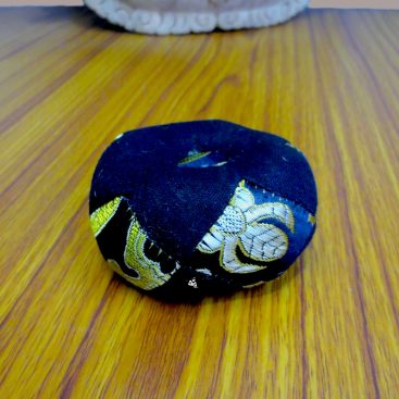 Patched Black Singing Bowl Cushion